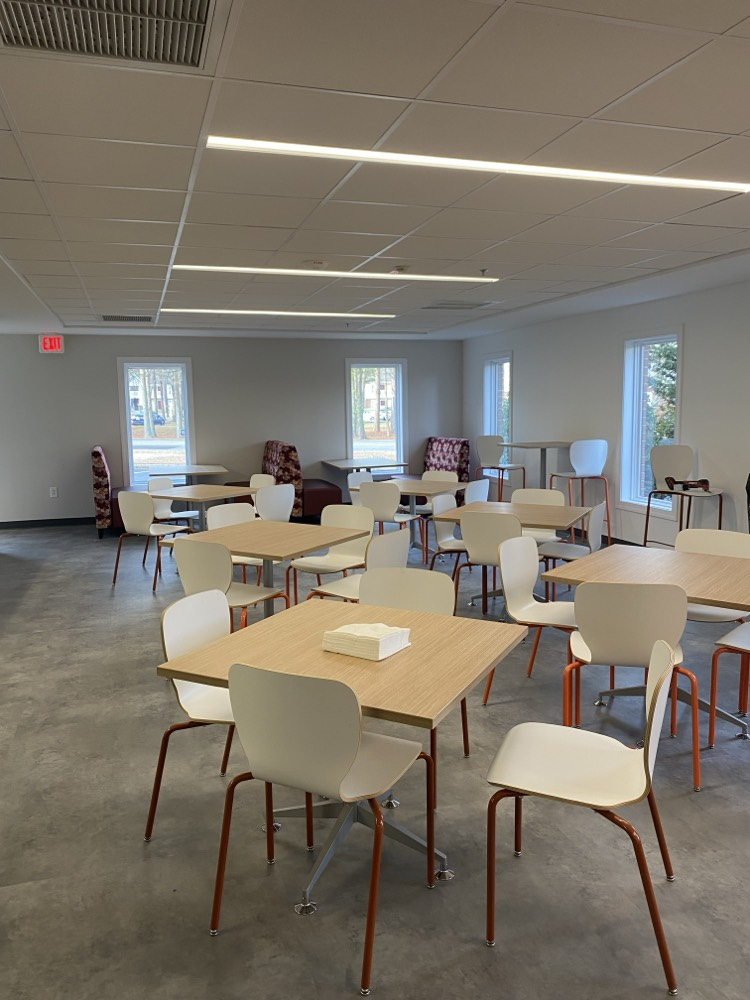 Empty Cafe seating four chairs around a table at the All Abilities Innovation and Inclusion Center