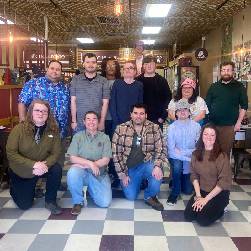 A graduate of Commonweath Autism's Career Readiness and Employment program for autistic adults pilots a canal boat along the James River in Richmond, Virginia.